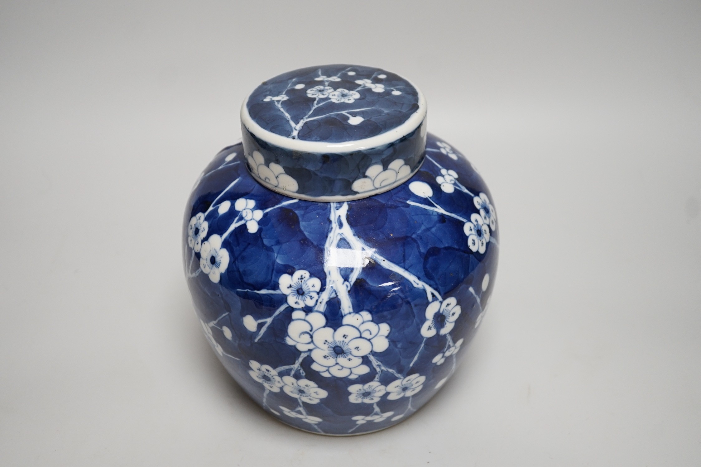 A Chinese blue and white prunus jar and cover, late 19th century, 20.5cms high